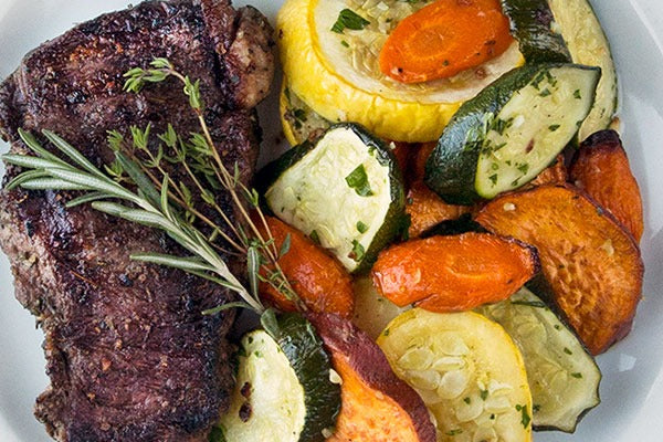 Rosemary Marinated Grilled Bison Steak with Roasted Vegetables: A Recipe Inspired by Solid Gold