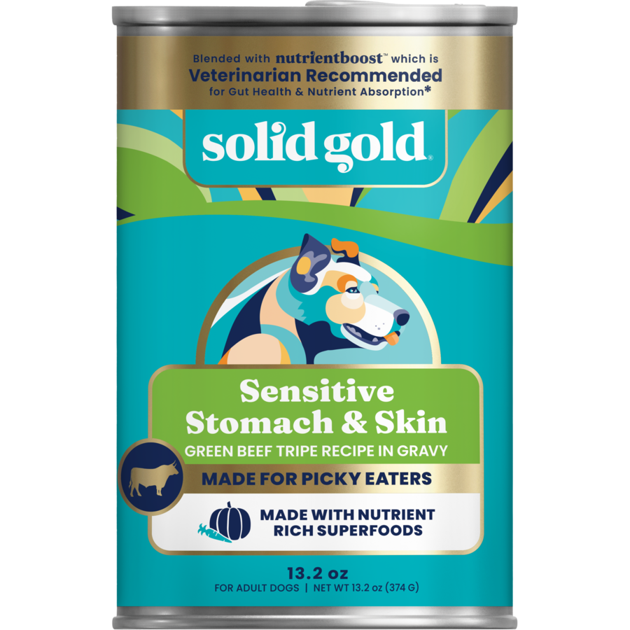 Can of wet dog food labeled "Sensitive Stomach & Skin," featuring a green beef tripe recipe in gravy.