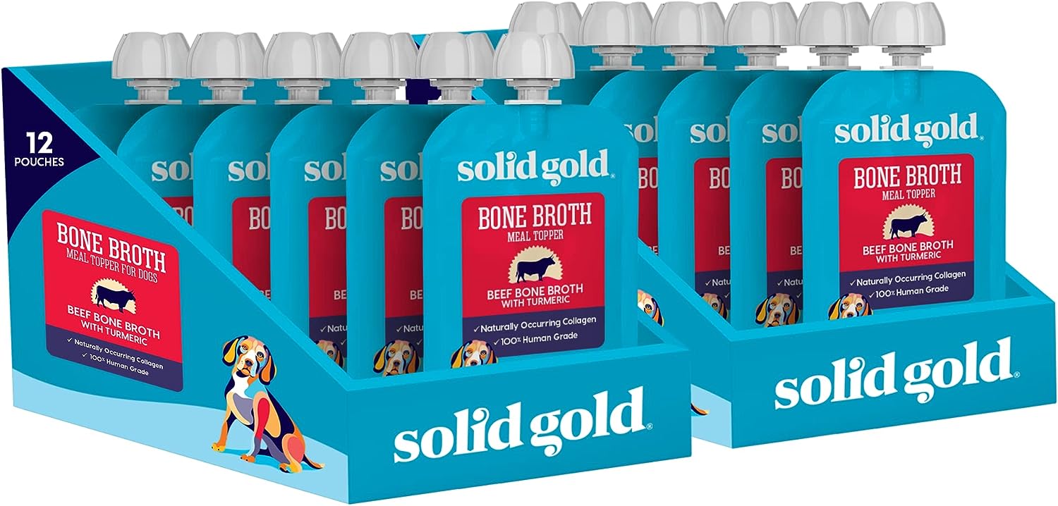 Twelve pouches of bone broth meal topper for dogs, featuring beef broth with turmeric, in a display box.