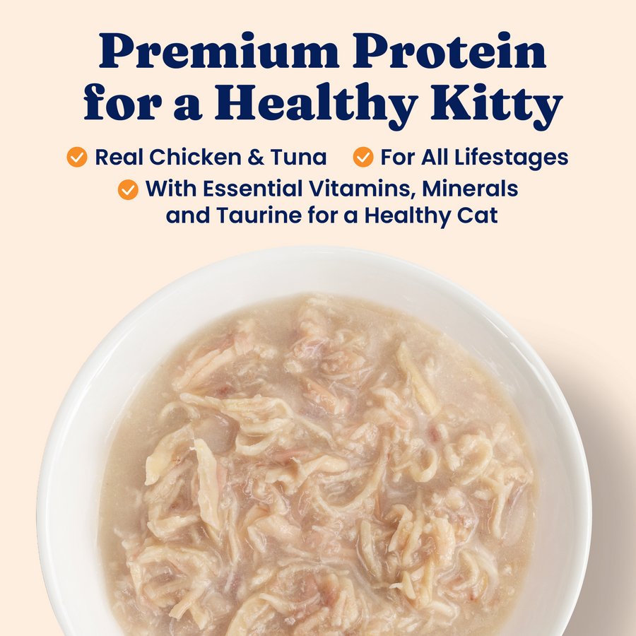 Bowl containing shredded chicken and tuna wet food with a creamy texture.