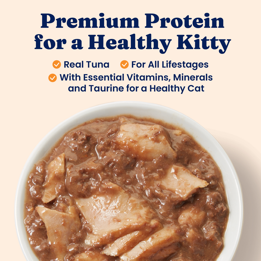 Wet cat food in a bowl featuring blended tuna and a thick gravy with chunks of fish.