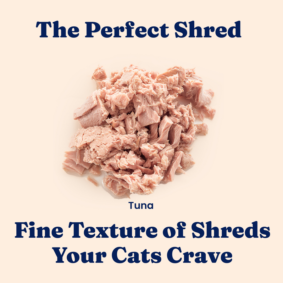 Shredded tuna wet food for cats, showcasing a fine texture in a pile on a light background.
