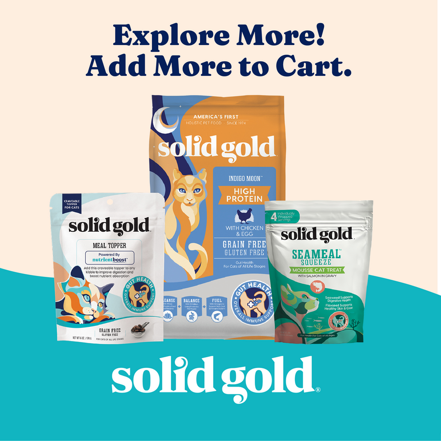 Three packages of cat food products from Solid Gold, including a meal topper, high protein food, and a mousse treat.