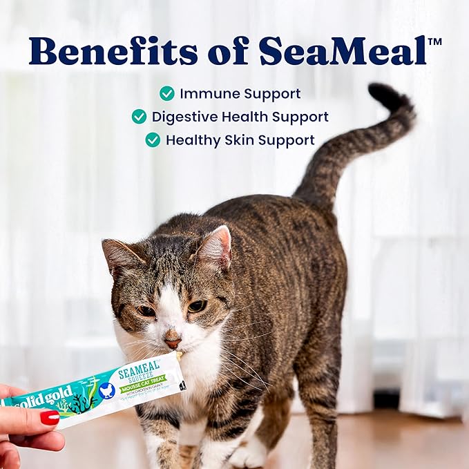 Cat interacting with a SeaMeal product with text highlighting benefits on a blurred background